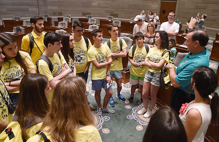Thirteen foreign exchange students are in Jefferson City for a brief stay and on Thursday visited the Capitol. Sen. Mike Kehoe, right, delivered a brief history of the building, and Mayor Carrie Tergin also was on hand to welcome the students.