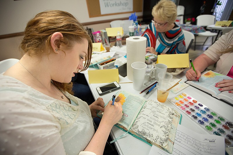 Sarah Elkins of Searcy Ark. practices during a Bible journaling seminar at the Baptist Book store in Texarkana.