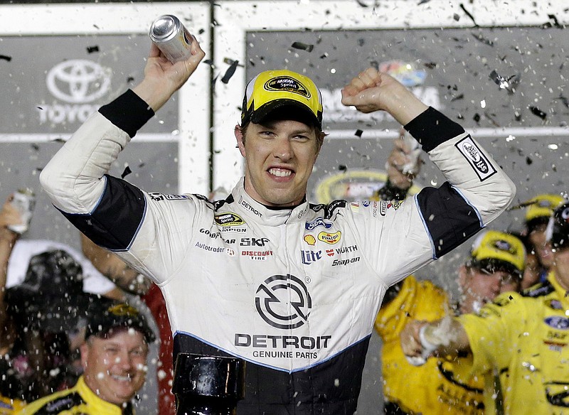 Brad Keselowski celebrates in Victory Lane after winning the NASCAR Sprint Cup Series auto race at Daytona International Speedway, Saturday, July 2, 2016, in Daytona Beach, Fla. 