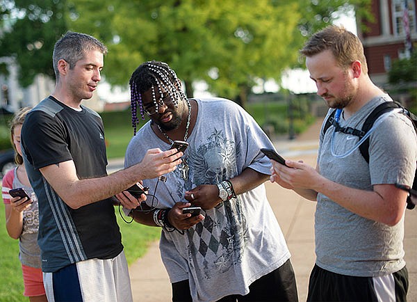 Jeremy Barnes, Larenzo Pickens and David Peters share and compare their stats and achievements in the widely popular new Pokemon GO game.