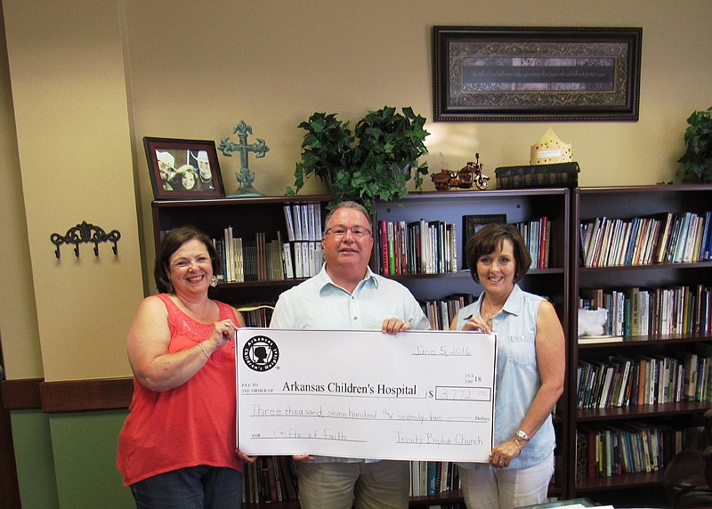 Trinity Baptist Church recently donated $3,772 to the Texarkana USA Chapter Circle of Friends, which raises money for Arkansas Children's Hospital. The funds comprised donations and take-out lunches to support the Gifts of Faith initiative for the hospital. Pictured, left to right, are Donna McLaughlin, Circle of Friends; Bill Saxby, Trinity Baptist Church; and Linda Willis, Circle of Friends.
