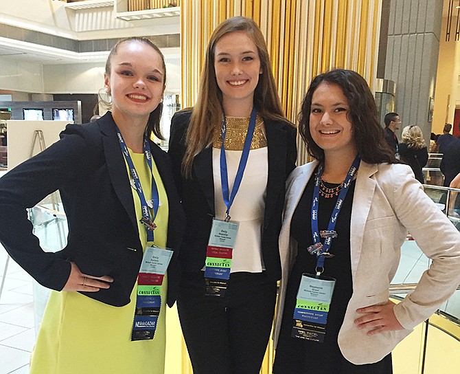 Emily Rackers, Emily Hoerchler and Stephanie Grant from Nichols Career Center Future Business Leaders of America, pose for a photograph at the FBLA national competition in Atlanta, Georgia.