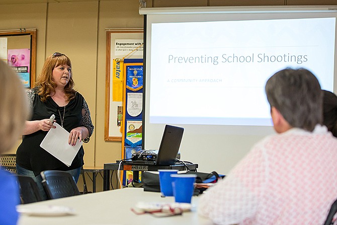 Susan Cook speaks to the Jefferson City Rotary Club on Tuesday evening about her Master's Degree work on school shootings.
