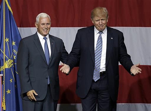 Indiana Gov. Mike Pence joins Republican presidential candidate Donald Trump at a rally in Westfield, Ind., Tuesday, July 12, 2016. 