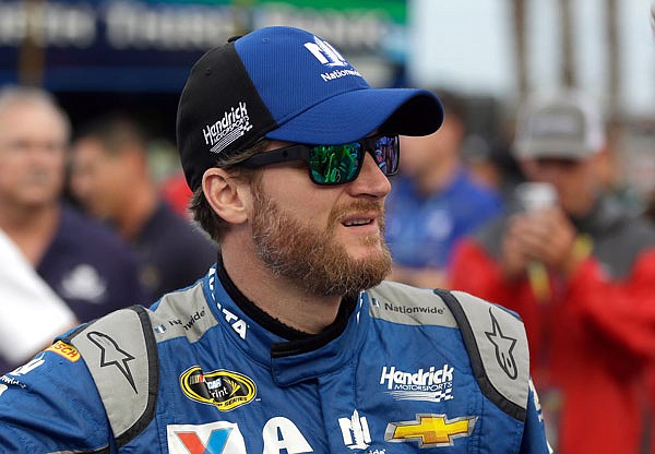 Dale Earnhardt Jr. waits by his car before the start of the NASCAR Sprint Cup Series race at Daytona International Speedway on July 2 in Daytona Beach, Fla. Earnhardt will not race this weekend because of concussion symptoms.  