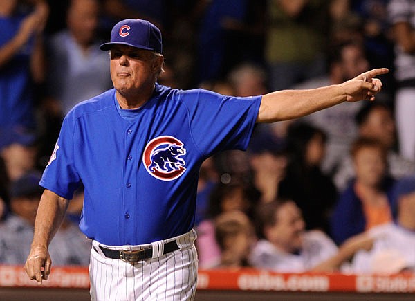 In this July 12, 2009, file photo, Cubs manager Lou Piniella signals for pitcher Sean Marshall to come back from left field to pitch in the ninth inning of the second game of a doubleheader against the Cardinals in Chicago. 