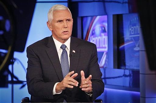 Indiana Gov. Mike Pence speaks during an interview with FOX News Channel's Sean Hannity after Donald Trump selected him for running mate on the Republican presidential ticket, Friday July 15, 2016, in New York.
