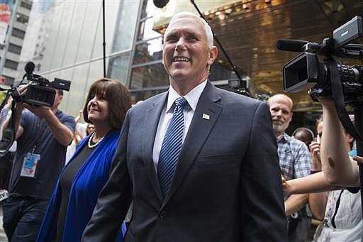 Indiana Gov. Mike Pence and his wife Karen leave a meeting with Republican presidential candidate Donald Trump at Trump Tower in New York, Friday, July 15, 2016.