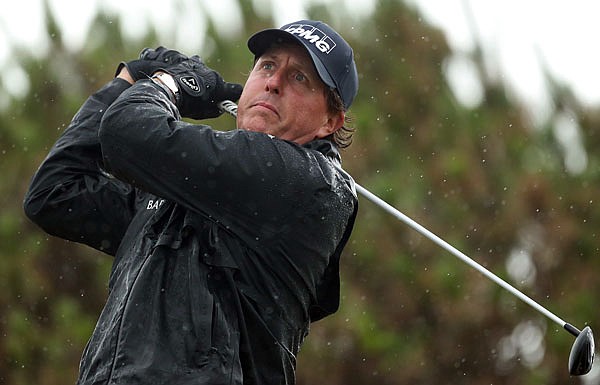Phil Mickelson watches his tee shot on the 13th hole Friday in the British Open at the Royal Troon Golf Club in Troon, Scotland.