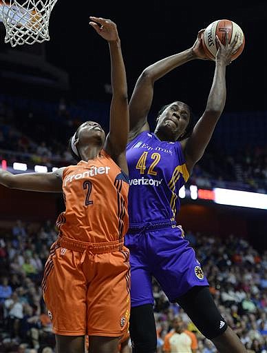 Los Angeles Sparks' Jantel Lavender, right, pulls down a rebound over Connecticut Sun's Camille Little, left, during first half of a WNBA basketball game, Friday, July 15, 2016, in Uncasville, Conn.