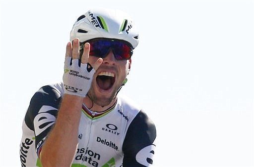 Britain's Mark Cavendish celebrates as he crosses the finish line of the fourteenth stage of the Tour de France cycling race over 208.5 kilometers (129.2 miles) with start in Montelimar and finish in Villars-les-Dombes, France, Saturday, July 16, 2016. 