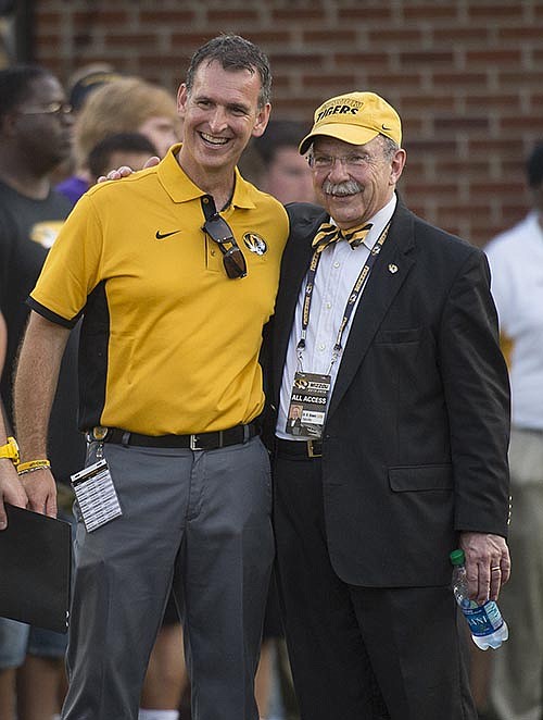 Then University of Missouri Athletic Director Mack Rhoades (left) and then chancellor R. Bowen Loftin pose for a photo after the 2015 season's 34-3 win against Southeast Missouri State at Faurot Field in Columbia.