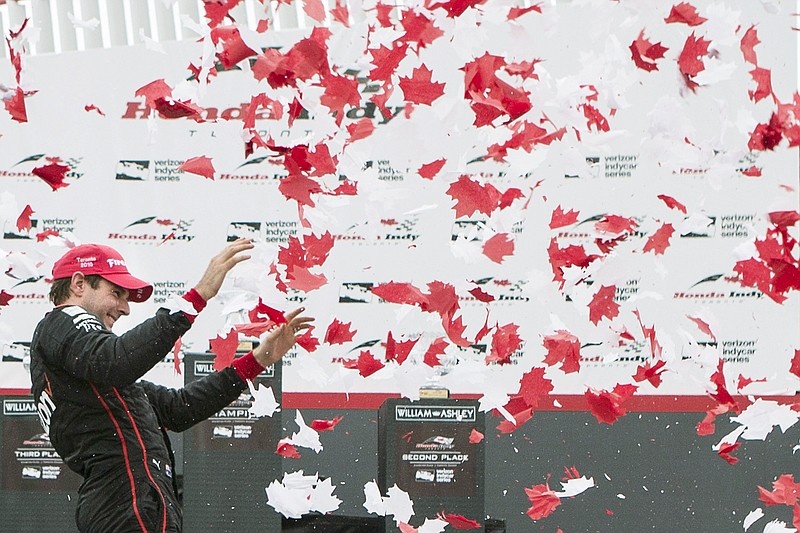 Will Power celebrates Sunday after winning the the IndyCar series race in Toronto.