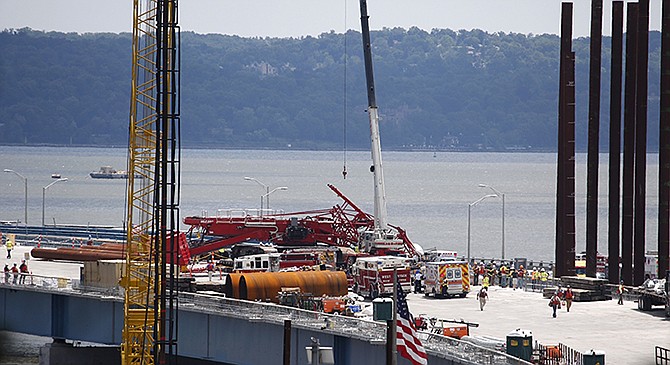 A construction crane is sprawled across lanes in both directions after collapsing Tuesday on the Tappan Zee Bridge in New York.