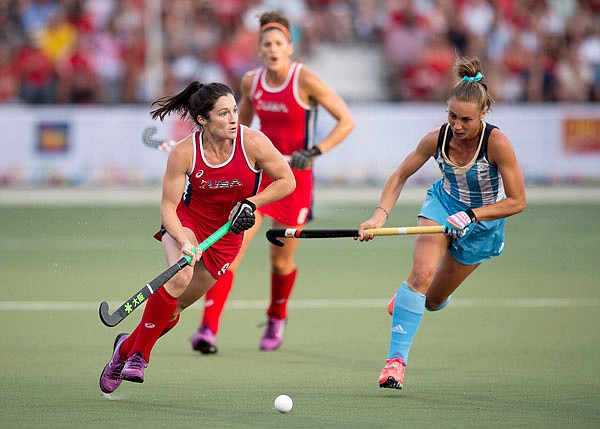 In this July 24, 2015, file photo, Rachel Dawson (left), of the United States, looks to pass in front of Florencia Habif, of Argentina, during the women's field hockey gold medal final at the Pan Am Games in Toronto. The U.S. is trying to make a push in women's field hockey.