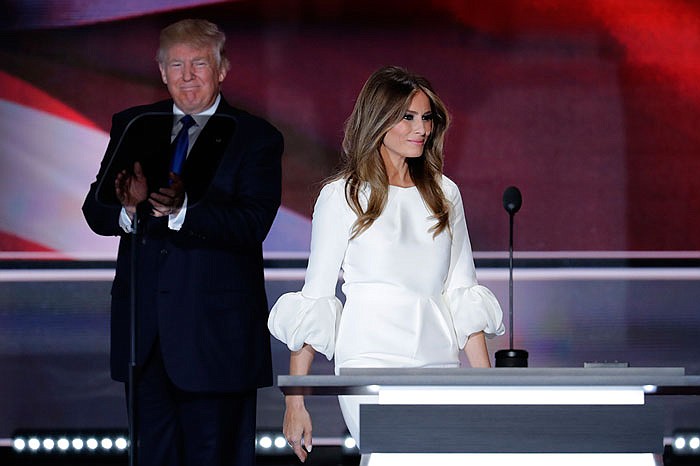 Melania Trump, wife of Republican presidential candidate Donald Trump, walks to the stage as her husband applauds during the opening day of the Republican National Convention in Cleveland. 
