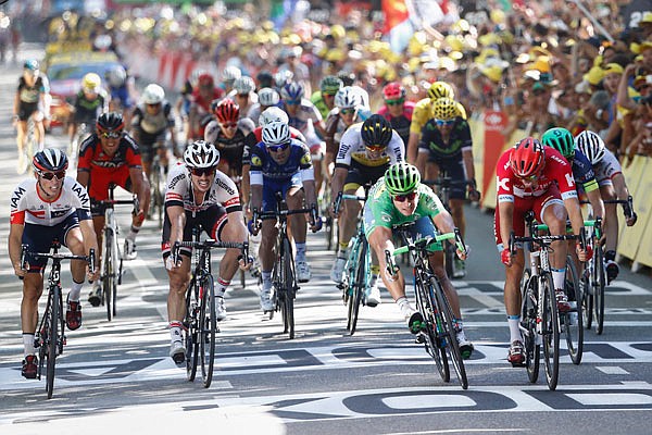 Peter Sagan, wearing the best sprinter's green jersey, crosses the finish line ahead of Alexander Kristoff (right) to win Monday's 16th stage of the Tour de France covering 130 miles between Moirans-en-Montagne in France and Bern in Switzerland, in Bern.