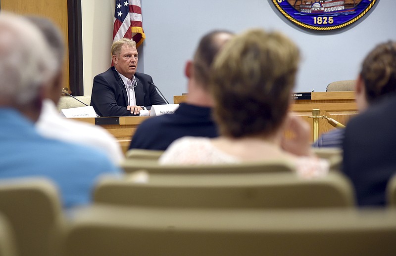 Western District commissioner incumbent Kris Scheperle speaks Tuesday at a forum at City Hall. Scheperle and Janet Ousely, his opponent, answered questions.