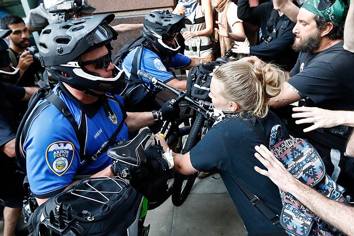 Protesters clash with police on Tuesday in Cleveland, during the second day of the Republican convention. 