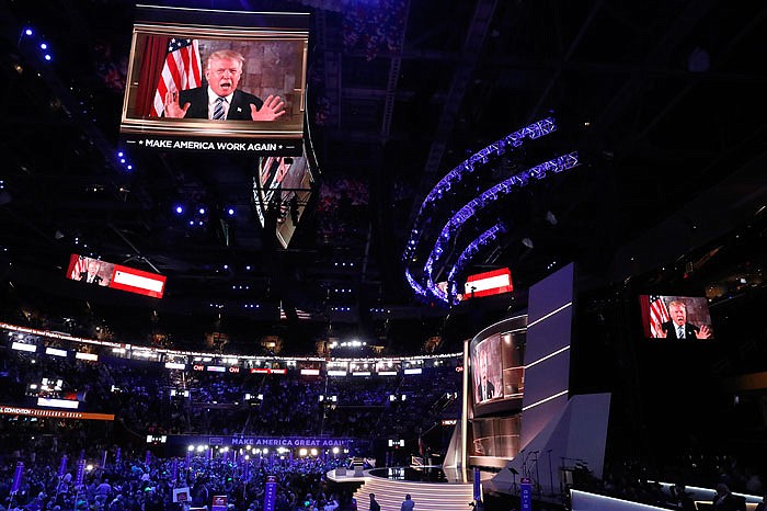 Republican presidential nominee Donald Trump addresses the Republican National Convention by video after delegates made him the party standard bearer.