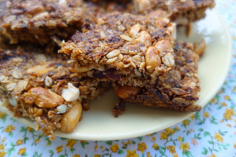This June 2016 photo shows date, coconut and peanut granola bars in London. This dish is from a recipe by Meera Sodha. 