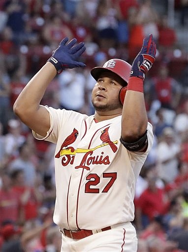 St. Louis Cardinals' Jhonny Peralta celebrates as he arrives home after hitting a solo home run during the fifth inning of a baseball game against the Miami Marlins Saturday, July 16, 2016, in St. Louis.