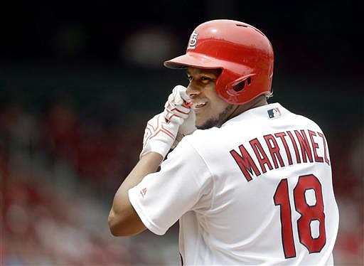 St. Louis Cardinals' Carlos Martinez celebrates after hitting a single during the third inning in the first game of a baseball doubleheader against the San Diego Padres Wednesday, July 20, 2016, in St. Louis. 