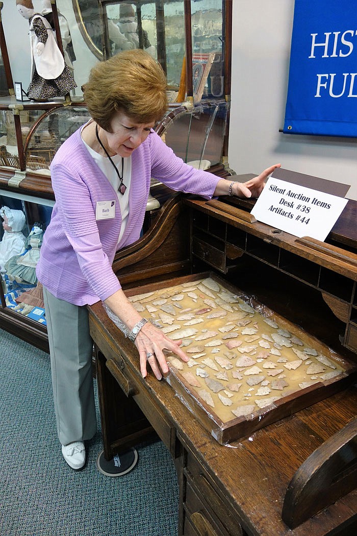 Barbara Huddleston shows off an arrowhead collection and a roll-top desk.