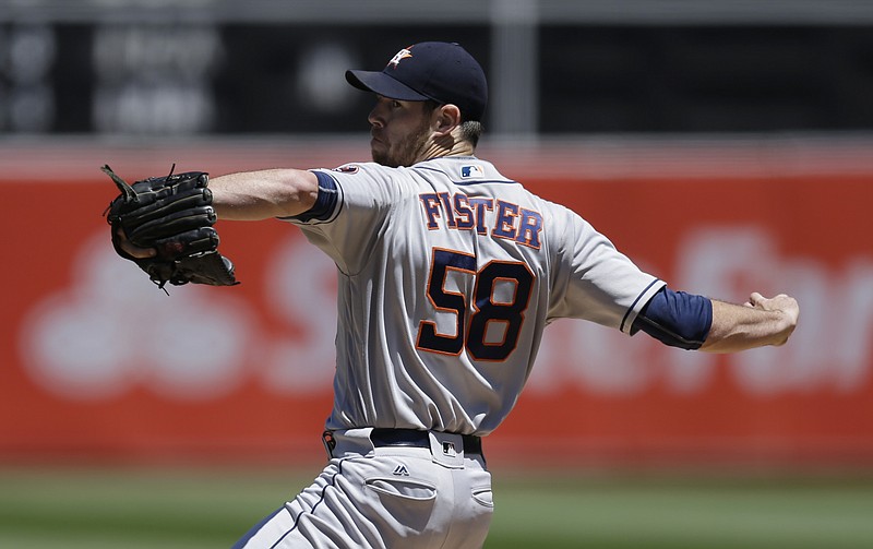 Houston Astros pitcher Doug Fister works against the Oakland Athletics in the first inning of a baseball game Wednesday, July 20, 2016, in Oakland, Calif. 