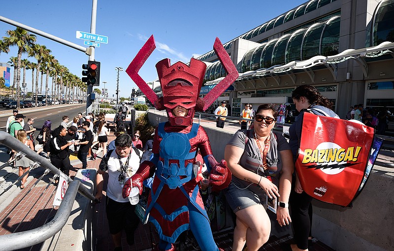 Bunny Knobel, dressed Galactus Eater of Worlds, walks with the crowd on the way to Preview Night at Comic-Con International held at the San Diego Convention Center Wednesday July 20, 2016, in San Diego. 