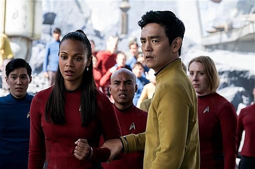 In this image released by Paramount Pictures, Zoe Saldana, left, as Uhura and John Cho as Sulu appear in a scene from, "Star Trek Beyond."