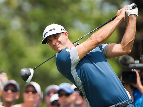 Dustin Johnson tees off on the second hole Thursday at the Canadian Open in Oakville, Ontario.