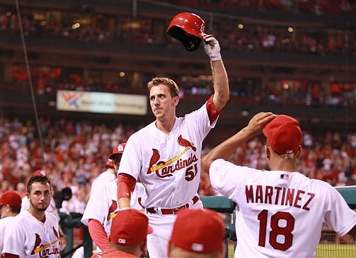 St. Louis Cardinals' Stephen Piscotty waves his batting helmet for a curtain call after tying the game with a three-run home run during the eighth inning of a baseball game against the San Diego Padres, Thursday, July 21, 2016 in St. Louis. (Chris Lee/St. Louis Post-Dispatch via AP)