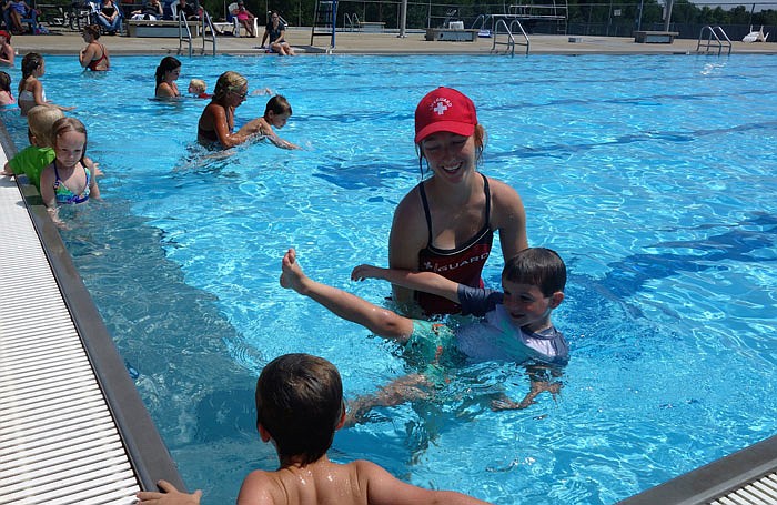 A lifeguard teaches kids to swim during lessons sponsored by the Fulton Parks and Recreation Department.