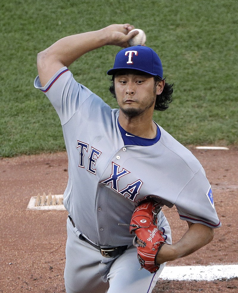 Texas Rangers starting pitcher Yu Darvish throws during the first inning of a baseball game against the Kansas City Royals on Friday, July 22, 2016, in Kansas City, Mo.