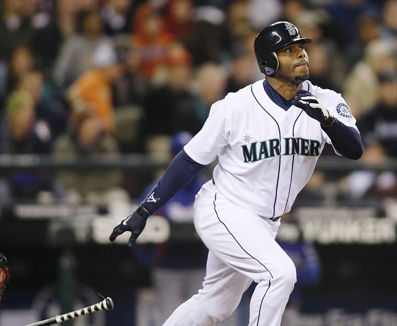 This is an Oct. 3, 2009, file photo showing Seattle Mariners' Ken Griffey Jr. hitting a solo home run on a pitch from Texas Rangers' Tommy Hunter during the fourth inning of a baseball game in Seattle. Griffey will be inducted into the Baseball Hall of Fame in Cooperstown, N.Y. on Sunday, July 24, 2016. 