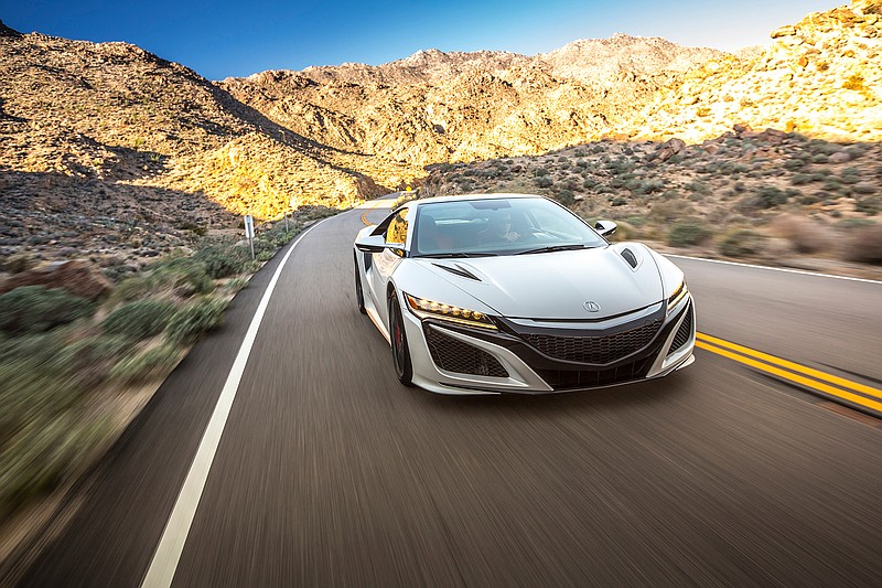 The 2017 Acura NSX is powered by a mid-mounted, twin-turbocharged 3.5-liter double-overhead-cam V6 engine mated to a nine-speed dual-clutch transmission.