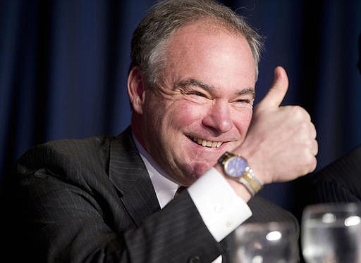  In this Feb. 4, 2016, file photo, Sen. Tim Kaine, D-Va., gives a 'thumbs-up' as he takes his seat at the head table for the National Prayer Breakfast in Washington. Kaine was chosen Friday by Hillary Clinton as her vice presidential running mate.