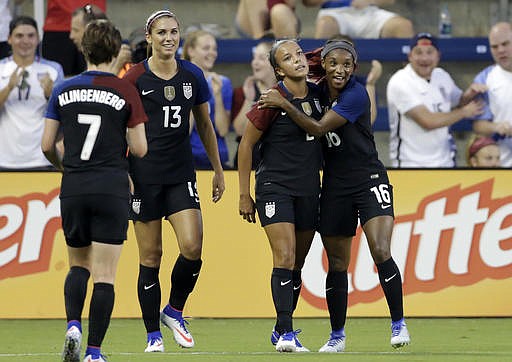 United States forward Mallory Pugh (2) is congratulated by Crystal Dunn (16) after scoring against Costa Rica in the first half of a women's international friendly soccer match, Friday, July. 22, 2016, in Kansas City, Kan. Looking on is defender Meghan Klingenberg (7) and forward Alex Morgan (13). 