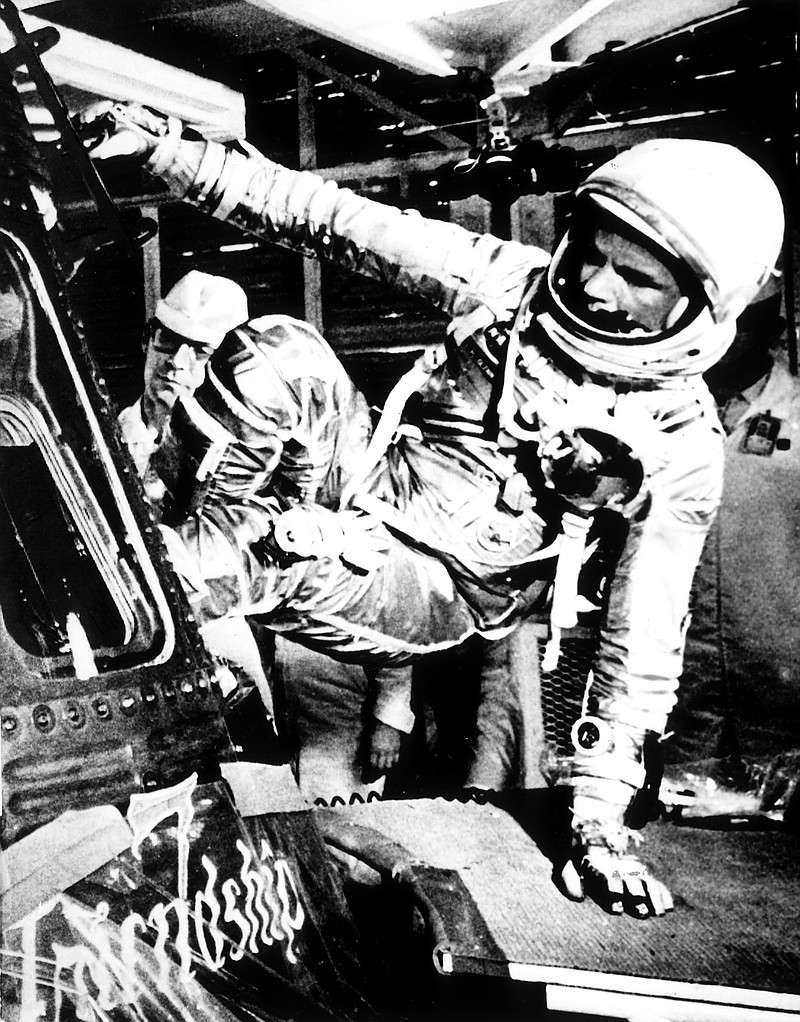 In this Feb. 20, 1962, file photo, U.S. astronaut John Glenn climbs inside the capsule of the Mercury spacecraft Friendship 7 before becoming the first American to orbit the Earth, at Cape Canaveral Air Force Station in Cape Canaveral, Fla. Nate D. Sanders Auctions says in-flight instructions used by former U.S. Sen. John Glenn, D-Ohio, as he became the first American to orbit the Earth sold for $66,993 on Thursday, July 21, 2016, in Los Angeles. 