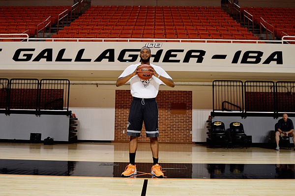 Oklahoma State basketball player Tyrek Coger poses July 6 in the gym at Gallagher-Iba arena in Stillwater, Okla. Coger died Thursday after a 40-minute team workout on the football stadium stairs in hot weather.