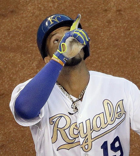 Kansas City Royals' Cheslor Cuthbert celebrates as he crosses the plate after hitting a solo home run during the third inning of a baseball game against the Texas Rangers on Friday, July 22, 2016, in Kansas City, Mo.