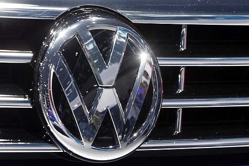 In this Sept. 22, 2015, file photo, the Volkswagen logo is seen on a car during the Car Show in Frankfurt, Germany. 