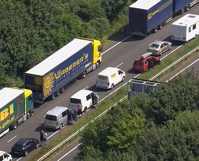 In this aerial view taken from video, part of the miles long queue of weekend traffic outside Dover, England, is shown waiting to cross the English Channel into France, which is under a state of emergency.  Heightened French border security checks caused massive disruption for many hours Saturday as some thousands of travelers tried to make the journey into France.