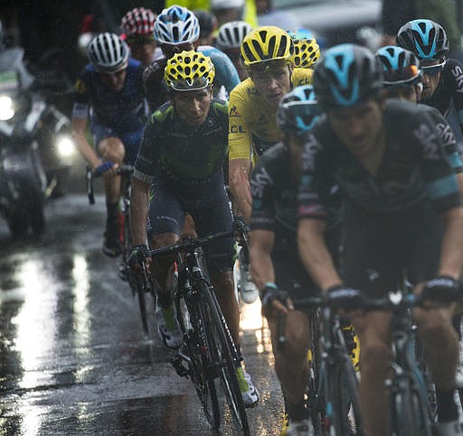 Britain's Chris Froome, wearing the overall leader's yellow jersey, and Colombia's Nairo Quintana, left of Froome, ride during the twentieth stage of the Tour de France cycling race over 146.5 kilometers (90.7 miles) with start in Megeve and finish in Morzine-Avoriaz, France, Saturday, July 23, 2016. 