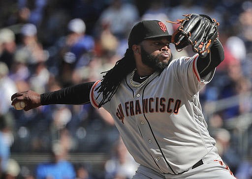 San Francisco Giants starting pitcher Johnny Cueto delivers against the New York Yankees during the first inning of a baseball game, Saturday, July 23, 2016, in New York.