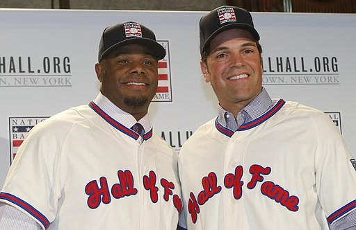 In this Jan. 7, 2016, file photo, Ken Griffey Jr., left, poses for a photograph with Mike Piazza at a press conference announcing they are both elected into the 2016 National Baseball Hall of Fame, in New York. The Seattle Mariners made Ken Griffey Jr. the first pick of the 1987 amateur draft and a year later the Dodgers selected Mike Piazza on the 62nd round with the 1,390th pick. Both left indelible imprints on the game.