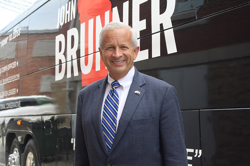 Republican candidate for Missouri governor John Brunner stands outside his campaign bus Friday, July 22, 2016 in Fulton.