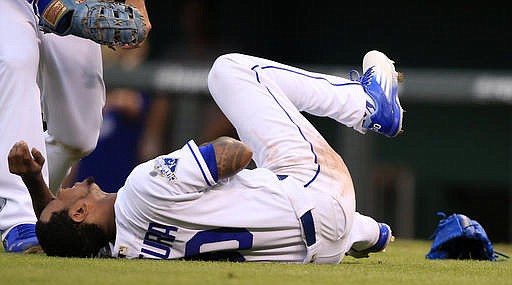 Kansas City Royals starting pitcher Yordano Ventura falls to the ground after being hit by a ball hit by Texas Rangers' Adrian Beltre during the fifth inning of a baseball game at Kauffman Stadium in Kansas City, Mo., Saturday, July 23, 2016.