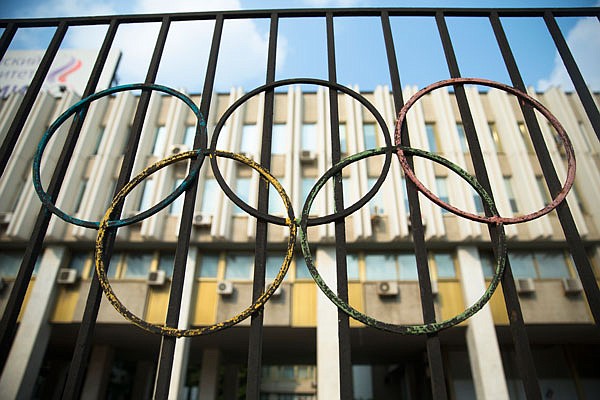 The Olympics rings are seen Sunday on a fence in front of the Russian Olympic Committee building in Moscow, Russia.